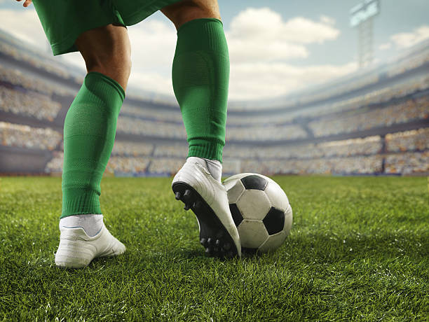 a boy kicking ball